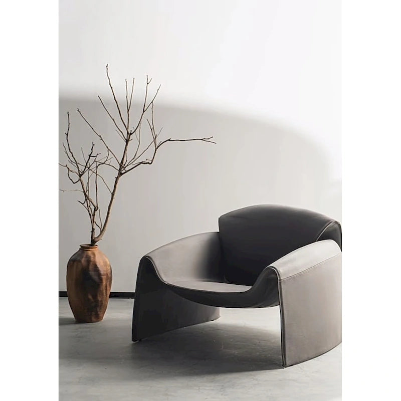 Curved Vegan Leather Armchair with High-Density Foam & Steel Frame